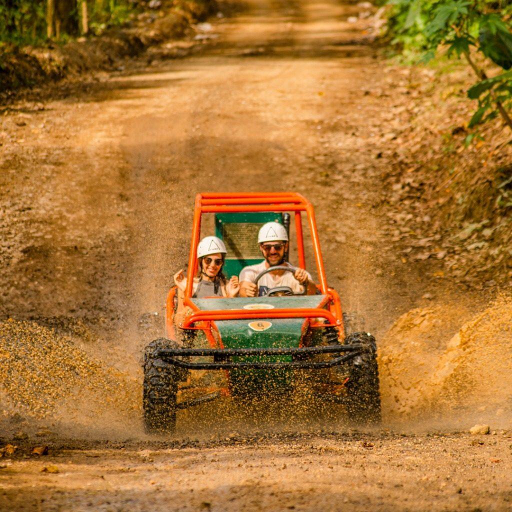 Guests smiling in an off-road buggy in Punta Cana